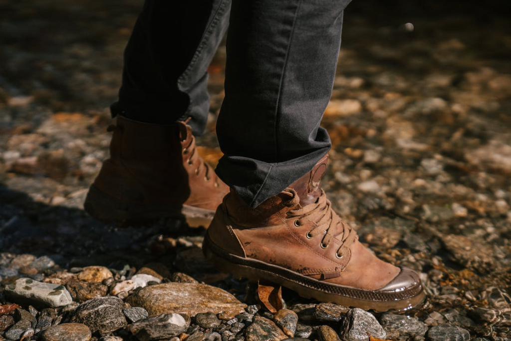 A person wearing brown hiking boots for men
