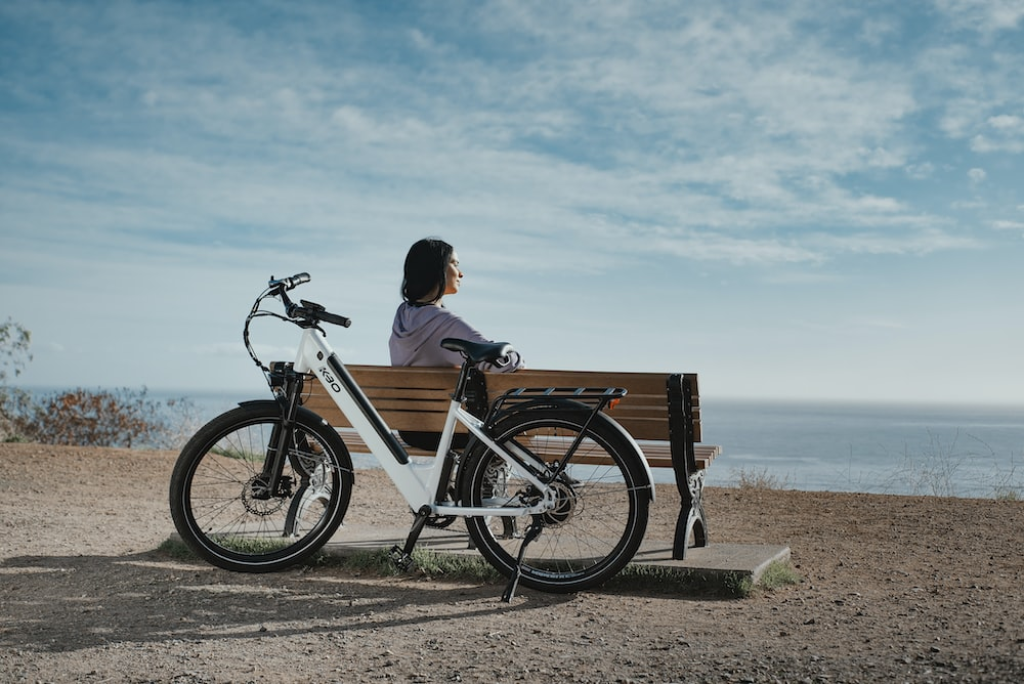 a woman riding an electric bike