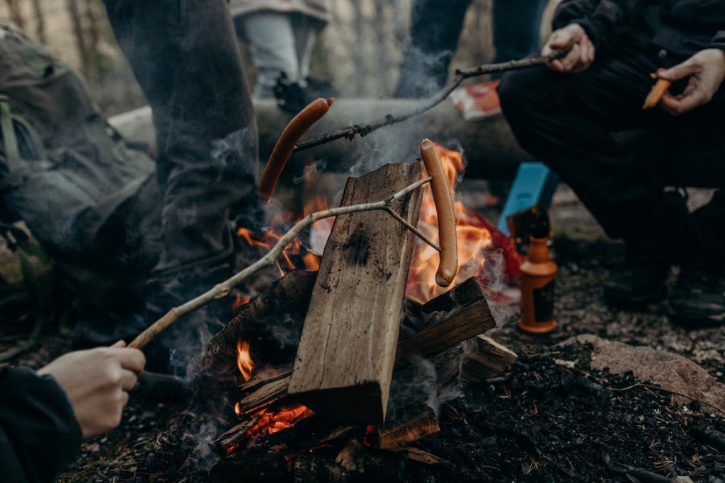 A steel pot over a campfire