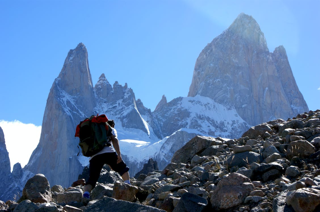 A mountaineer climbing a rocky mountain
