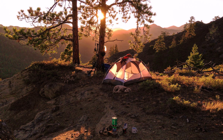 An advanced camping gear tent on top of a mountain.