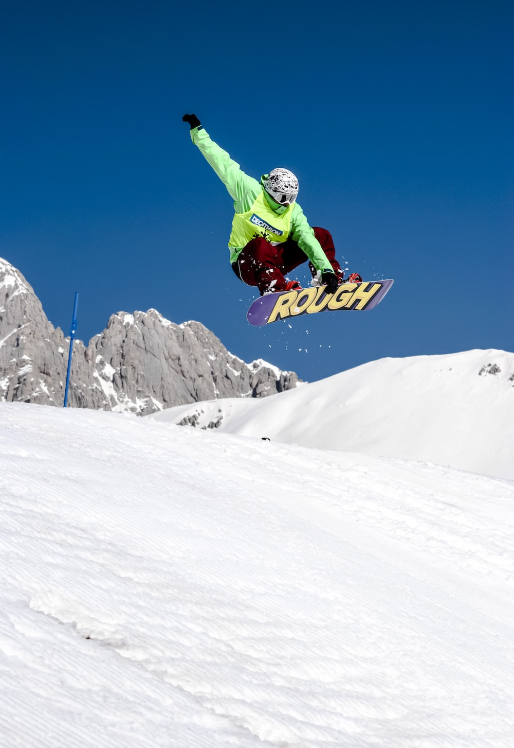 A person riding a snowboard in the air.