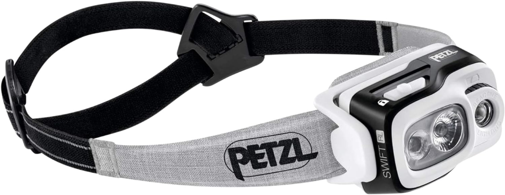 A petzl headlamp on a white background.